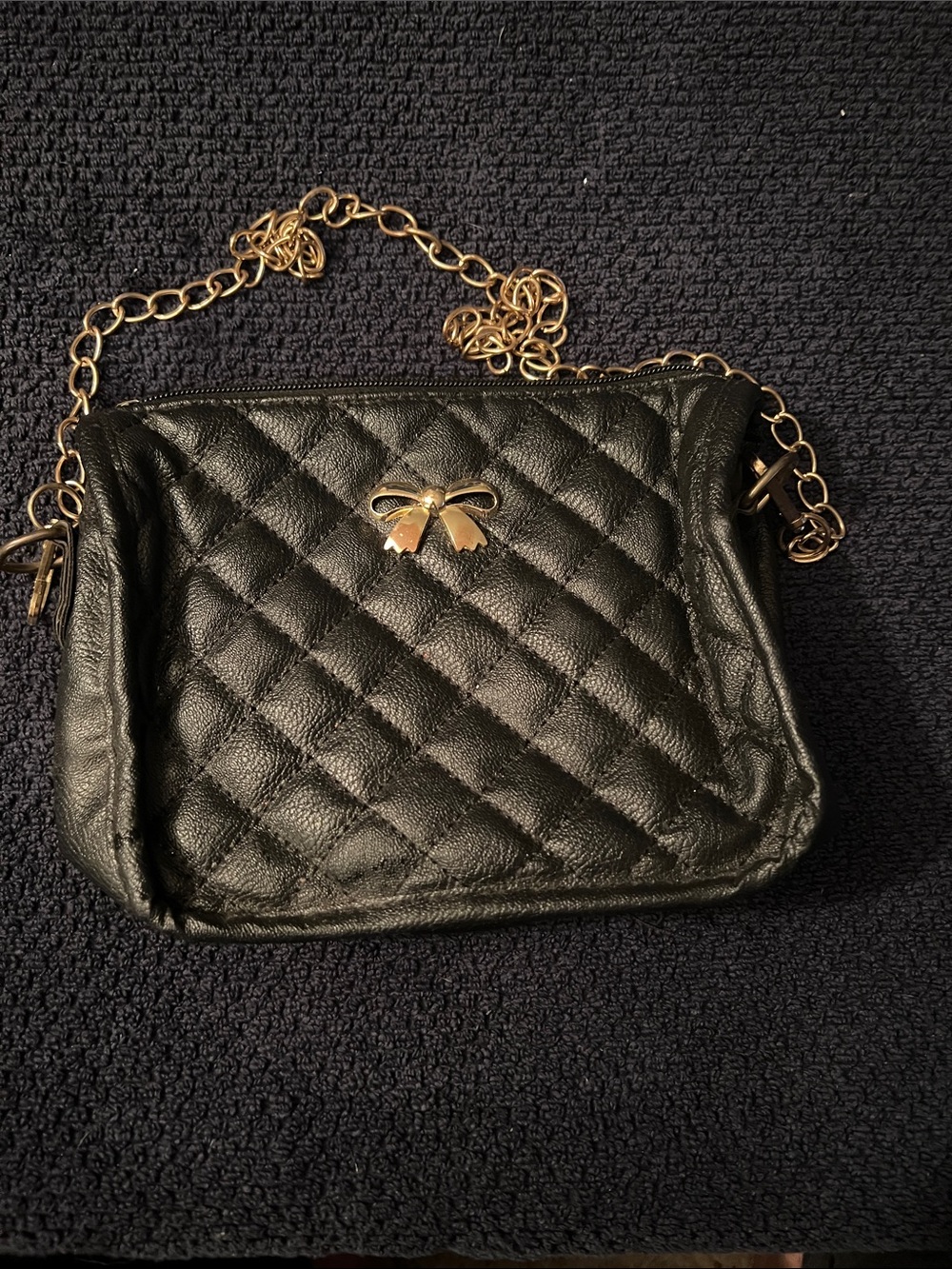 Quilted Black Crossbody Bag with Gold Bow Accent